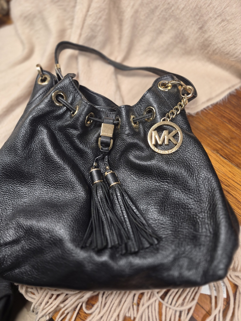 Michael Kors Black Pebbled Leather Tassel Drawstring Hobo with Gold MK Charm